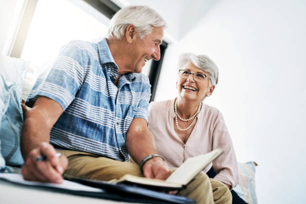 Shot of a senior couple going through their paperwork together at home formation e commerce