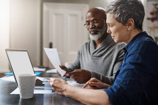 Shot of a senior couple working on their finances at home